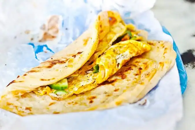 Egg-stuffed porotta hot off the griddle